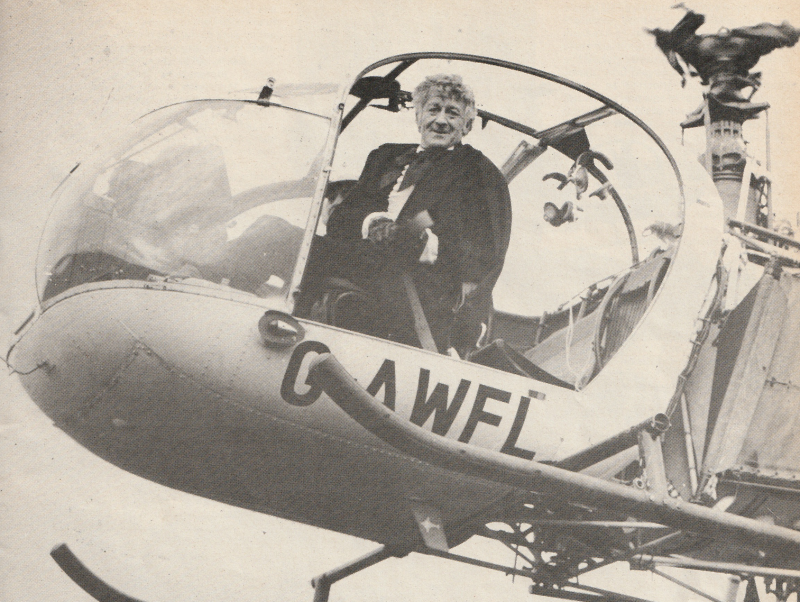 Black and White photo of Jon Pertwee as the Third Doctor in a Helicopter.
